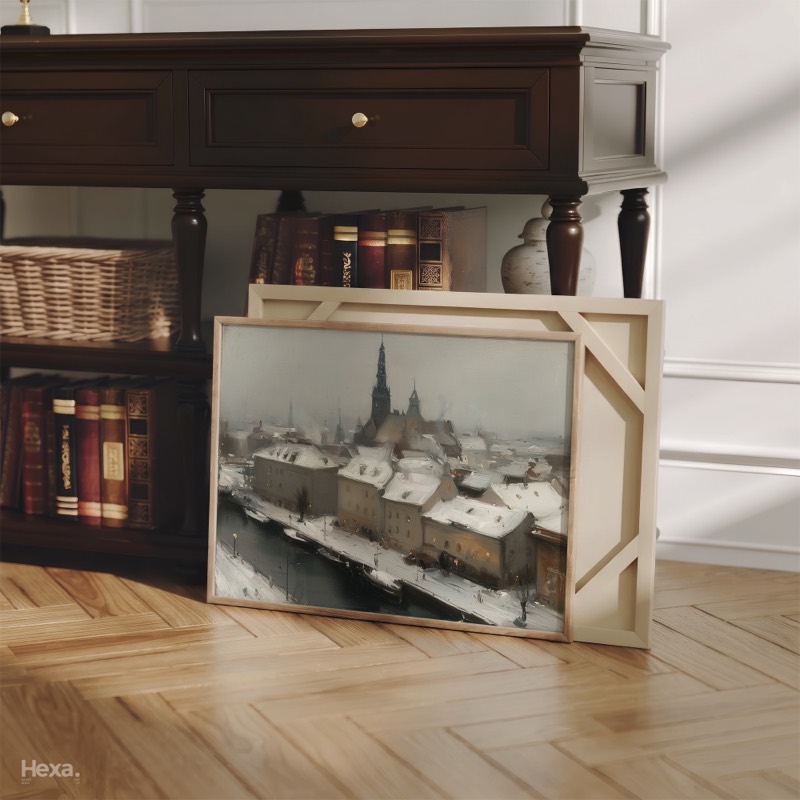 Snowy Old Town and Spire, framed print leaning against a wainscoted wall